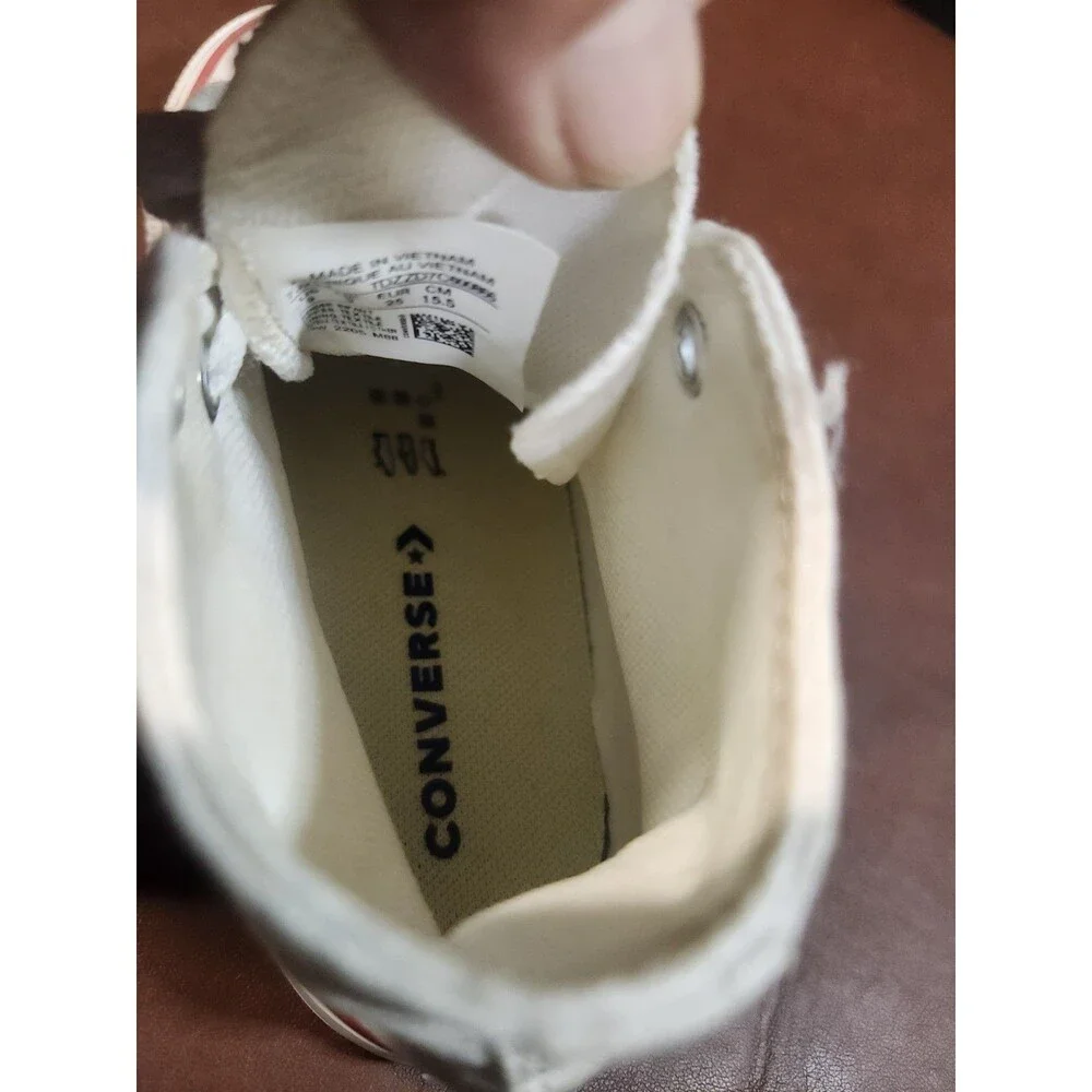 white canvas Converse Chuck Taylor All Star high-top sneakers